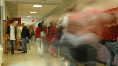 School hallway with blurred students walking